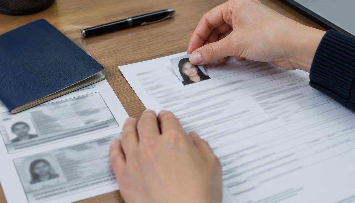 Attaching a photo to a PAN Card Form 49AA application beside passport copies